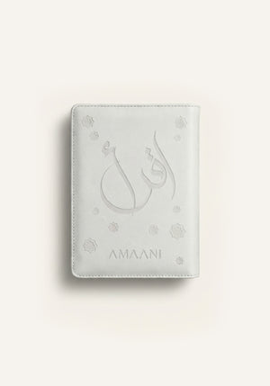 Amaani white leather Quran cover with embossed Arabic calligraphy design