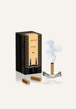 Amaani Oud Al Kaabah oud brick burning on crystal bakhoor burner with soft smoke and luxury Islamic packaging