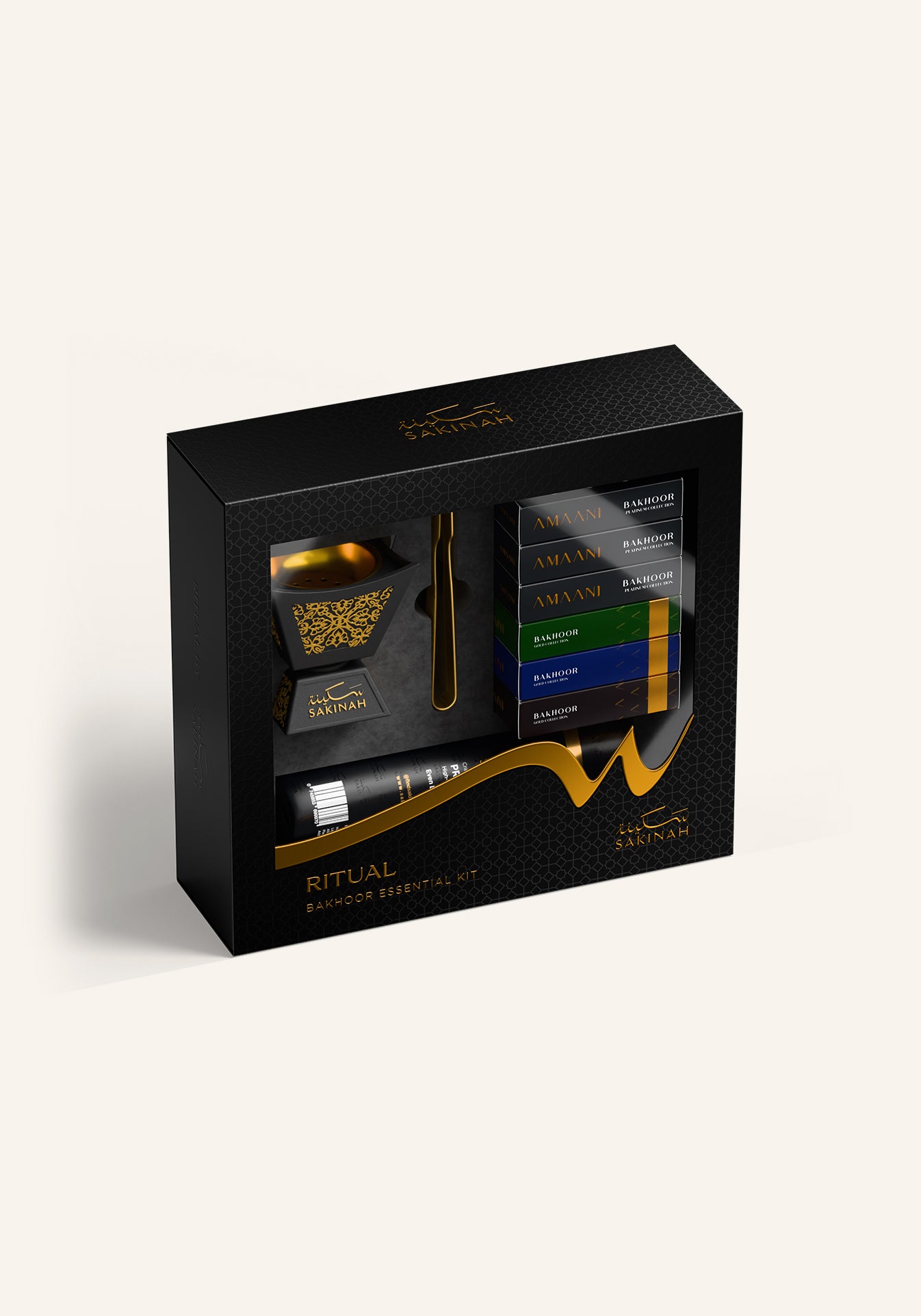 Sakinah Ritual Bakhoor Set - Hijaz in black, a premium bakhoor gift set with a gold-patterned stone burner, six Amaani bakhoor samples, charcoal and gold tongs in a Sakinah gift box
