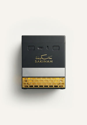 Sukoon Bakhoor Quran Speaker by Sakinah with built-in bakhoor burner, black and gold Islamic design, front view