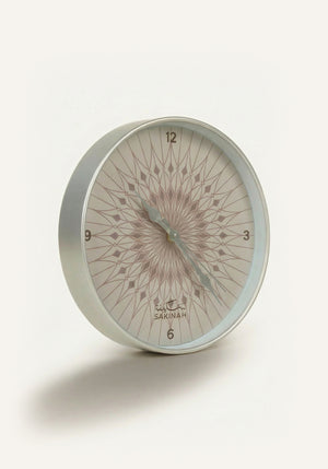 Close-up of Medinah Umbrella Islamic wall clock showing silver detailing and English numerals