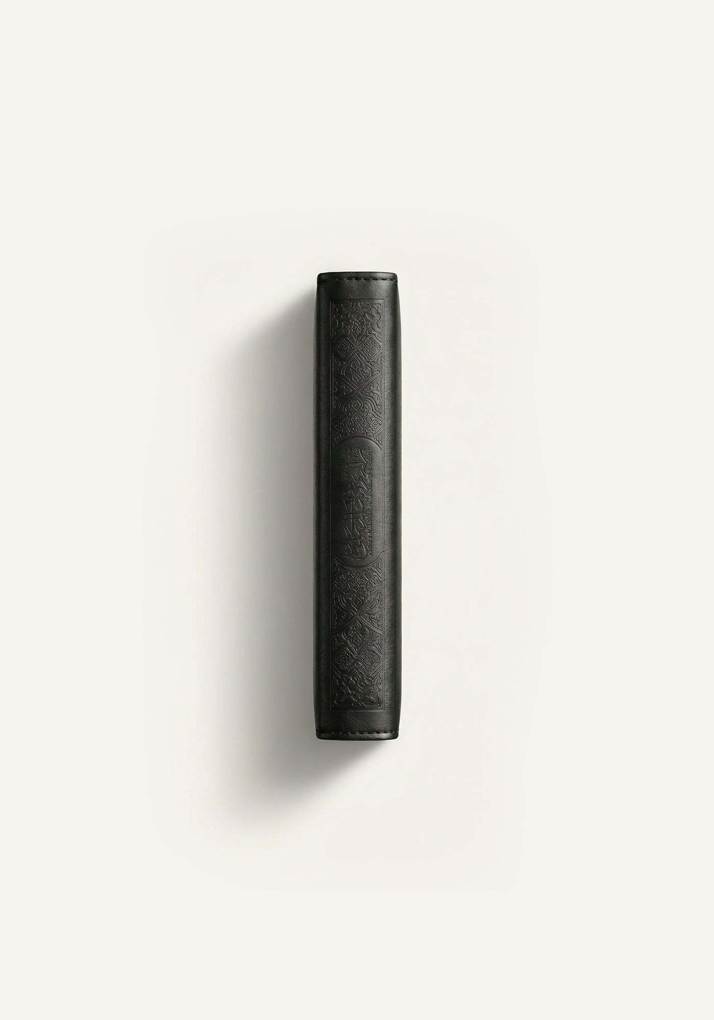 Side view of Amaani black leather Quran cover with embossed Islamic pattern