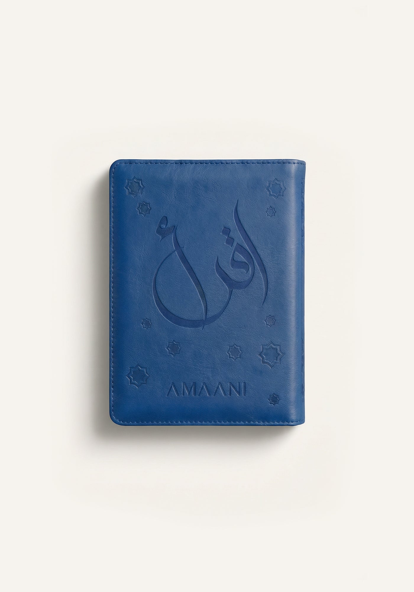 Amaani navy leather Quran cover with embossed Arabic calligraphy design