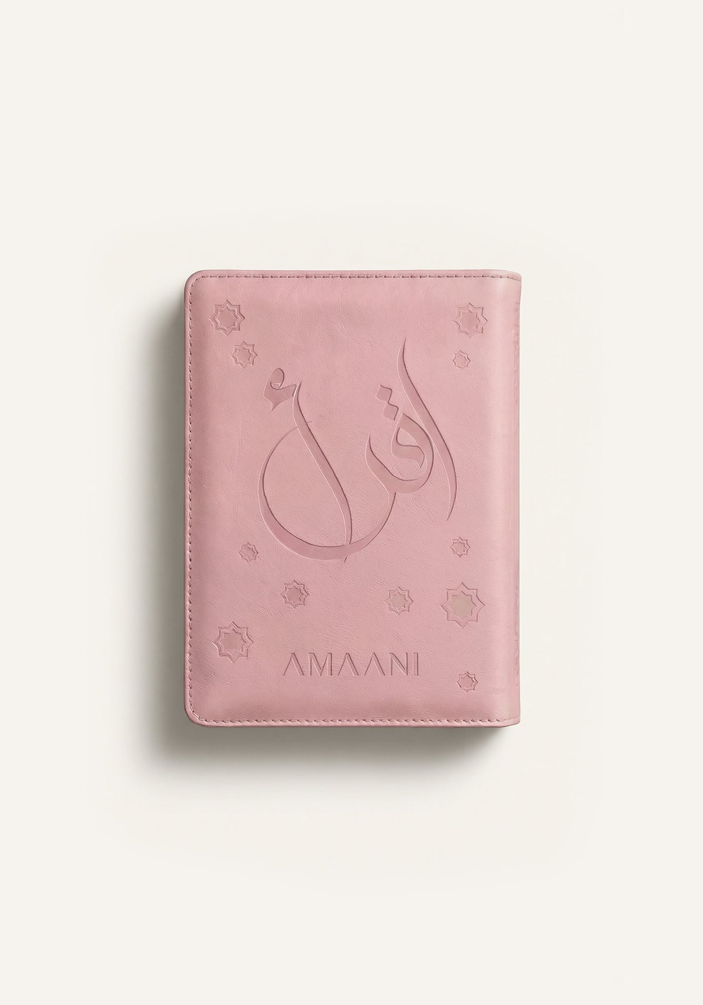 Amaani pink leather Quran cover with embossed Arabic calligraphy design