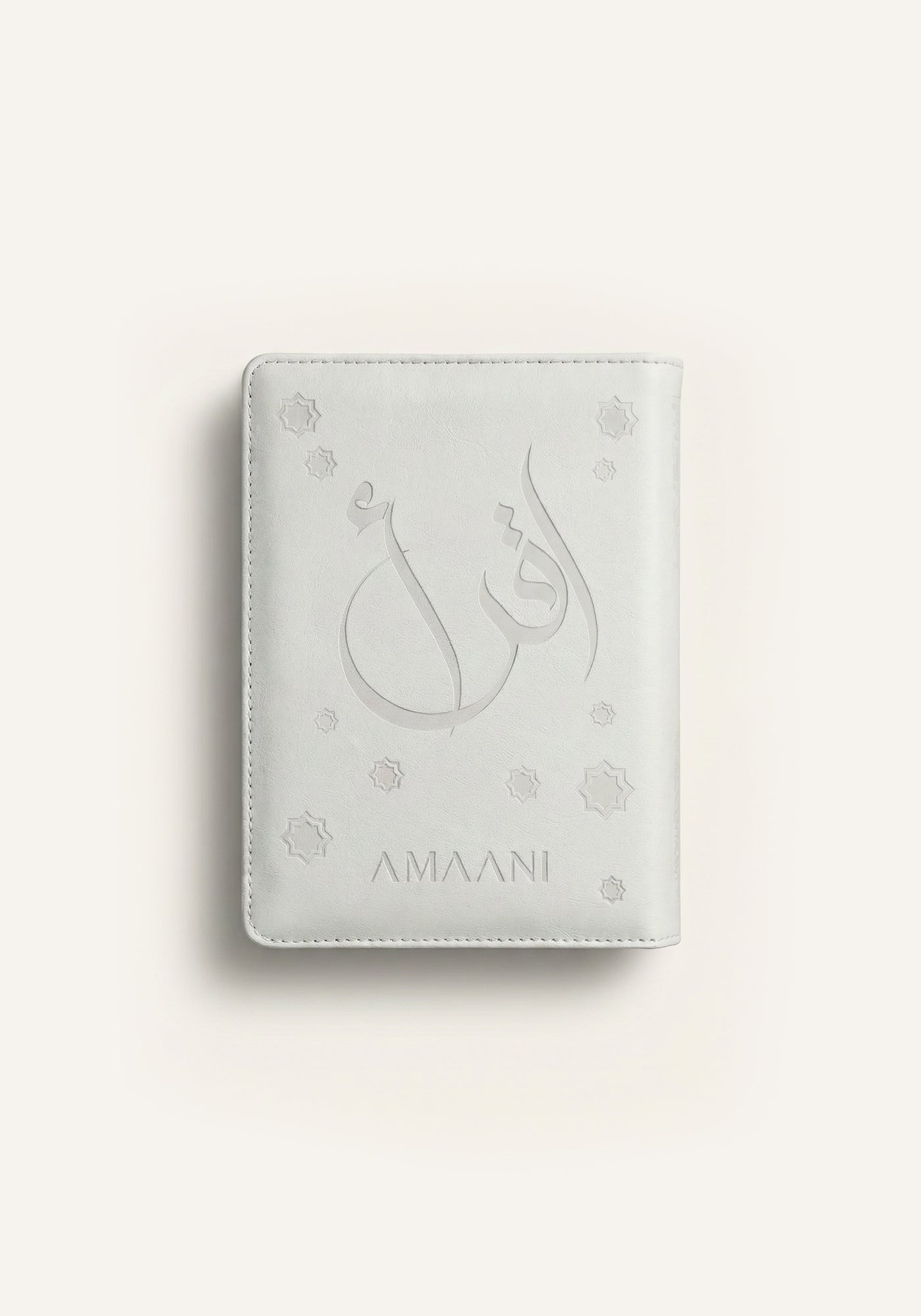 Amaani white leather Quran cover with embossed Arabic calligraphy design