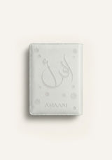 Amaani white leather Quran cover with embossed Arabic calligraphy design