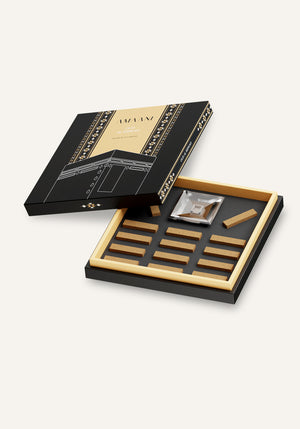 Amaani Oud Al Kiswah open gift box displaying premium oud bricks arranged inside luxury Islamic packaging