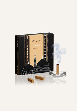 Amaani Oud Al Medinah oud bricks displayed with bakhoor burner and rising smoke in luxury Islamic gift box
