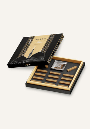 Amaani Oud Al Medinah premium oud bricks arranged inside luxury presentation gift box with bakhoor burner