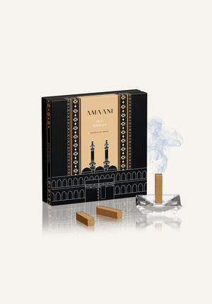 Amaani Oud Makkah premium oud bricks displayed with incense burner and aromatic smoke, luxury Islamic bakhoor set