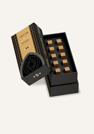 Amaani Oud Al Hajar Al Aswad oud bricks refill box opened to reveal ten premium incense bricks inside
