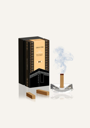 Amaani Oud Al Kiswah bakhoor bricks with incense burner releasing smoke, luxury oud fragrance refill