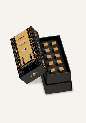 Amaani Oud Al Kaabah oud bricks refill box opened to reveal ten premium incense bricks inside gift packaging