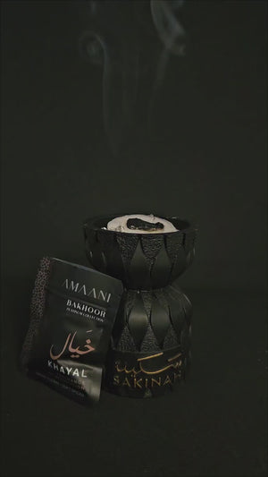 Sakinah Ritual Bakhoor Set Layali being lit and used at home with Amaani bakhoor