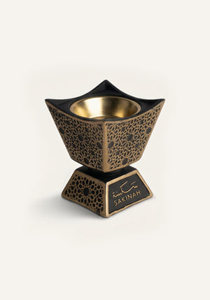 Qasr Bakhoor Burner by Sakinah in black with gold interior bowl, luxury Islamic home fragrance burner