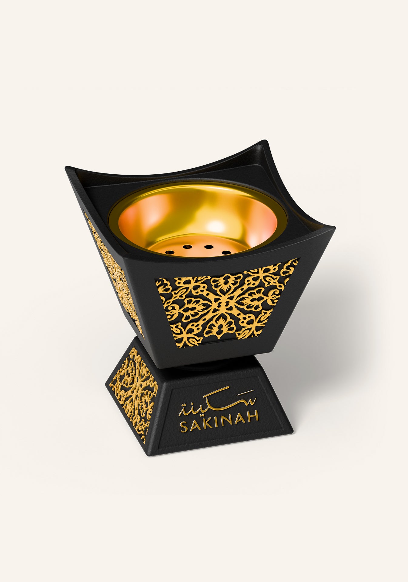 Close up of the black and gold Hijaz bakhoor burner with an Arabic floral pattern and removable inner metal cup, part of the Sakinah Ritual bakhoor gift set