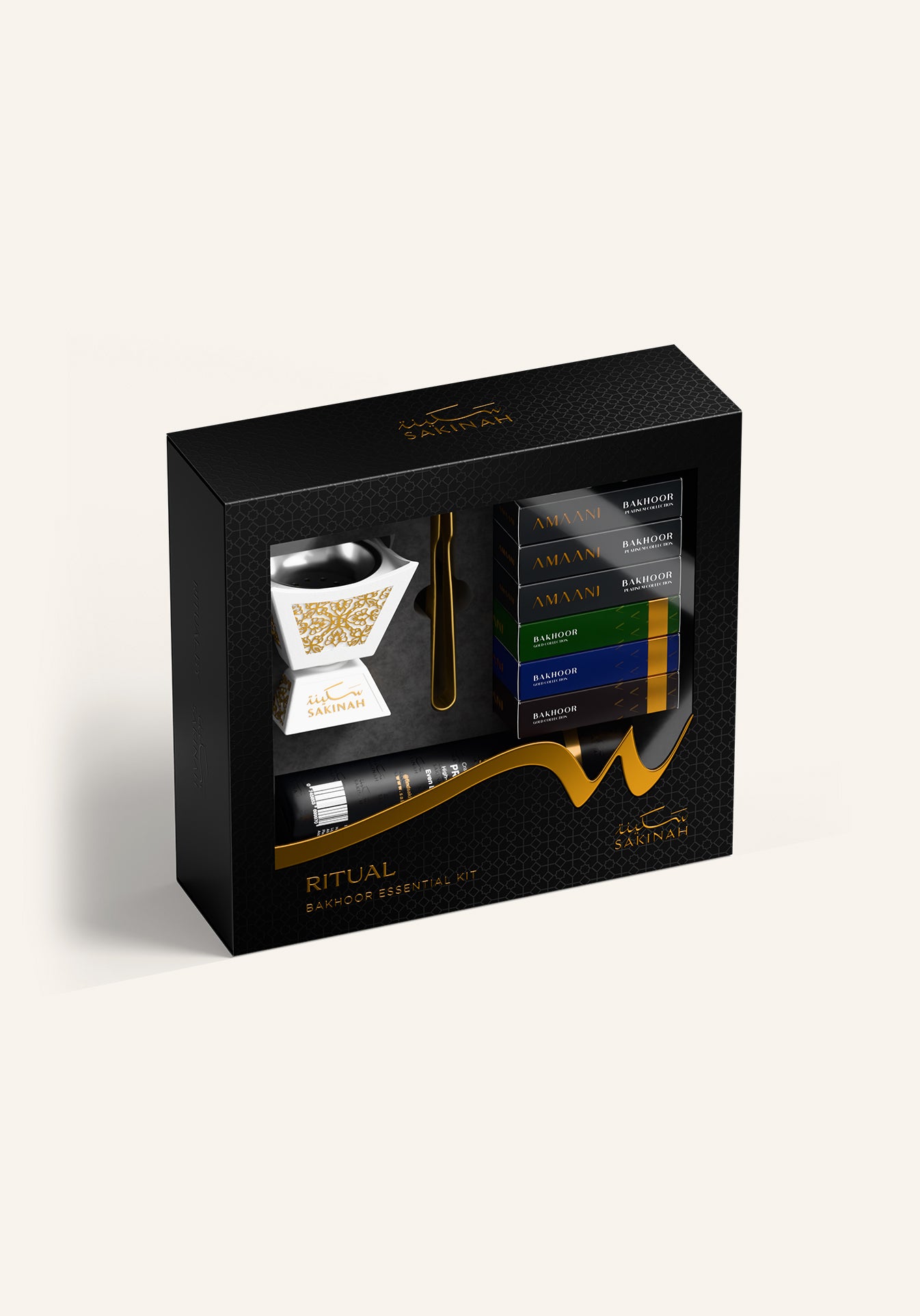 Sakinah Ritual Bakhoor Set - Hijaz in white, a white and gold bakhoor burner with six Amaani bakhoor samples, charcoal and gold tongs in a premium Sakinah gift box
